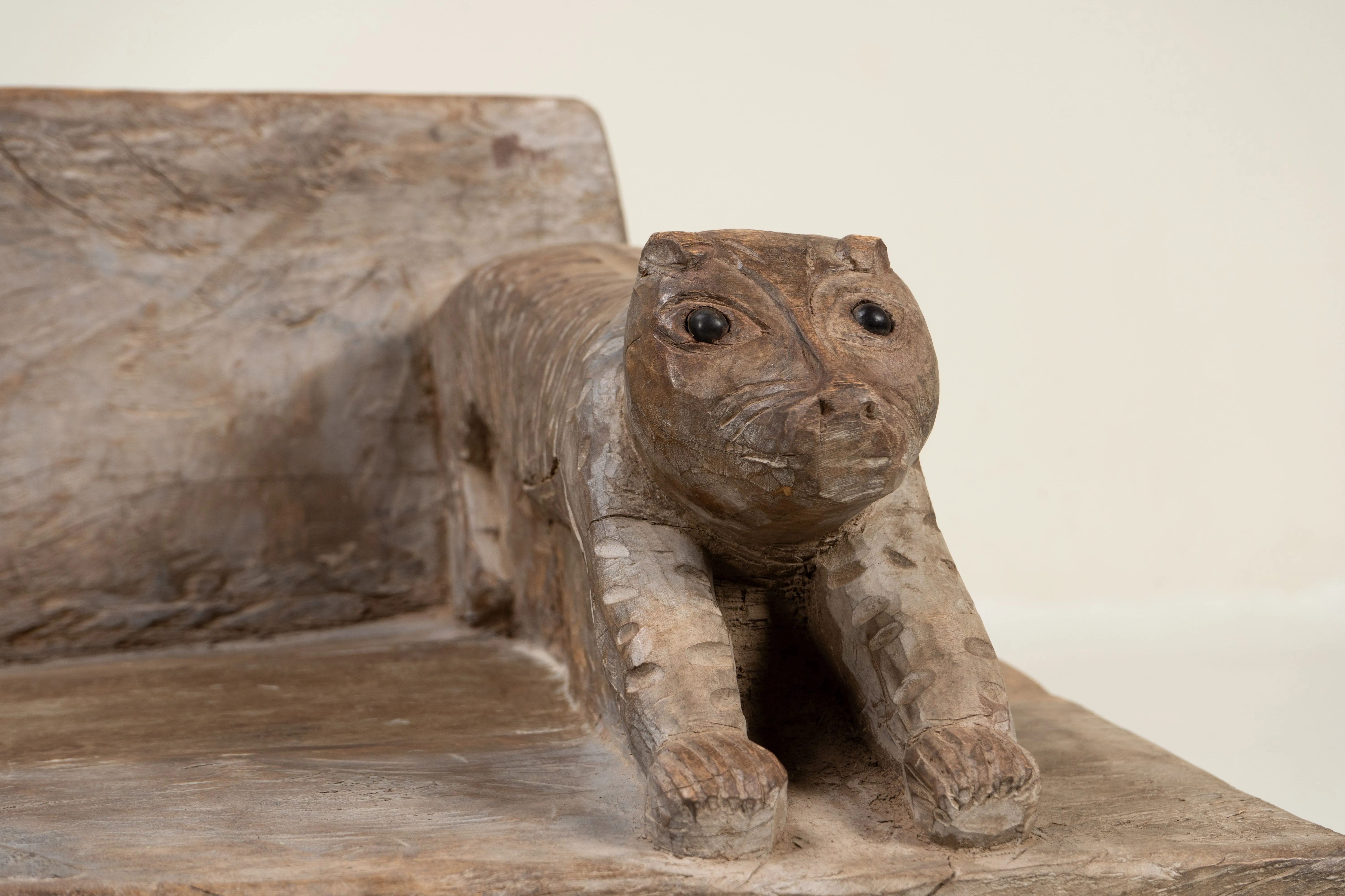 A Wooden Sofa Bench with Animal Sculptures