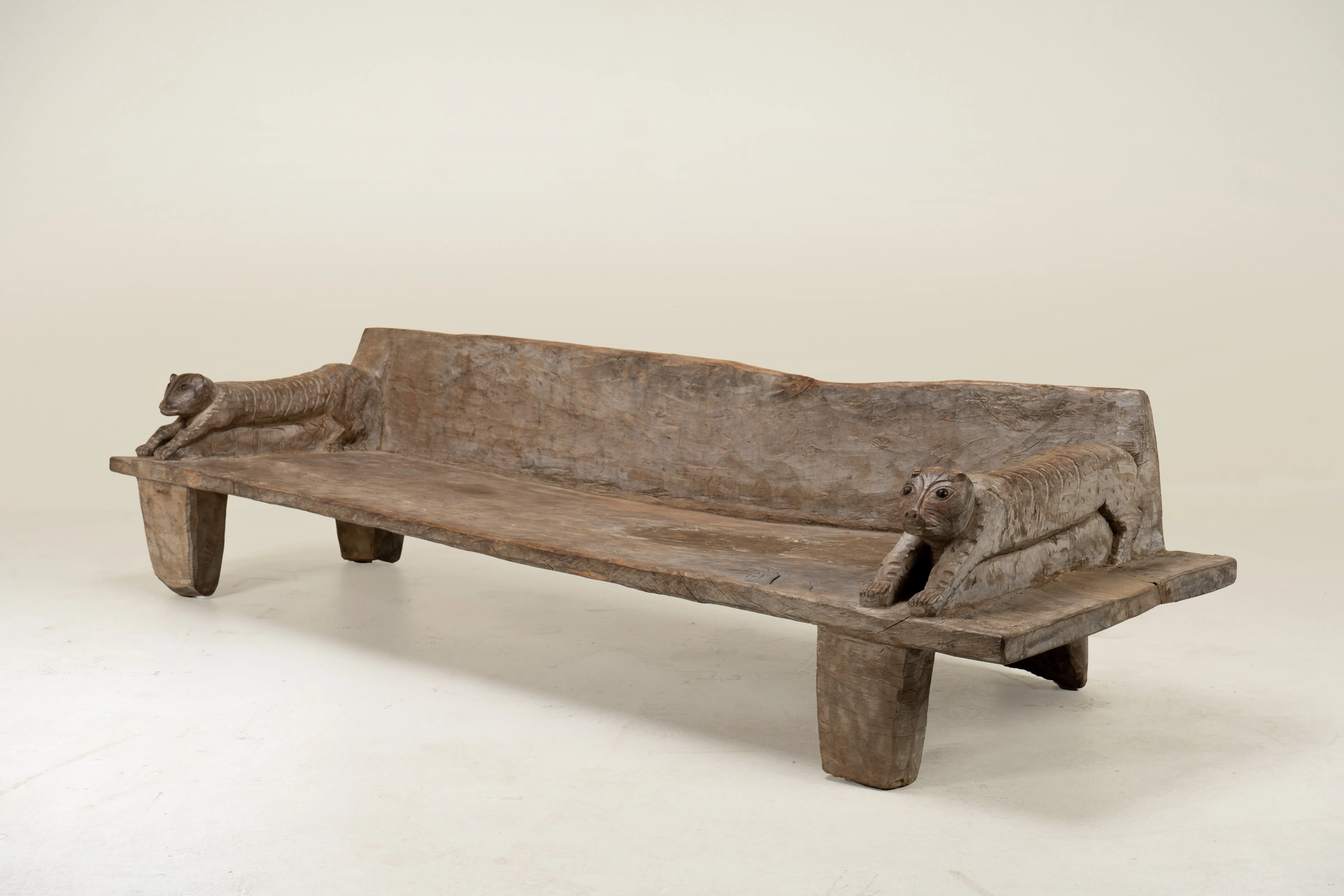 A Wooden Sofa Bench with Animal Sculptures