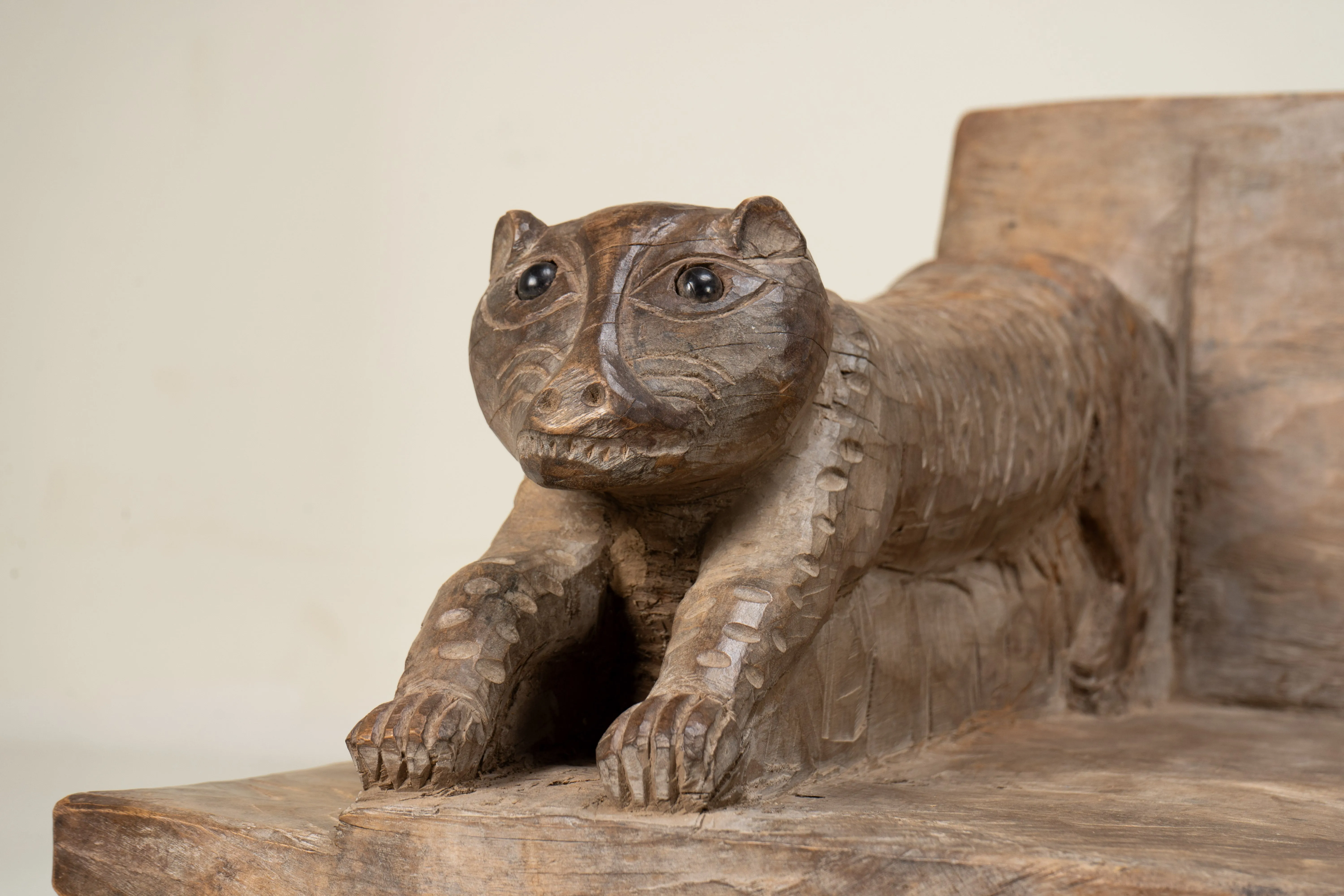 A Wooden Sofa Bench with Animal Sculptures