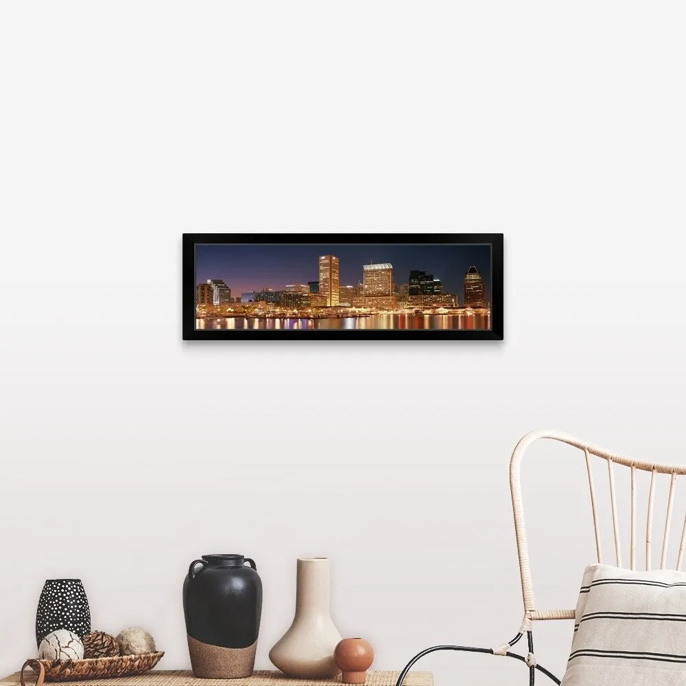 "Buildings lit up at dusk, Baltimore, Maryland" Black Framed Print